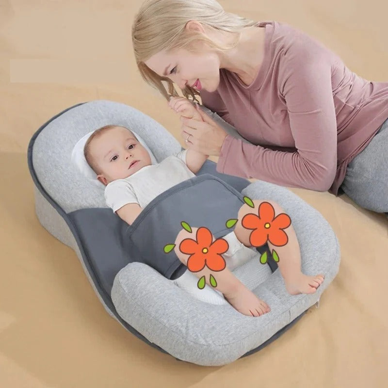 Baby anti-spit-up inclined sleep support pillow for reflux relief & comfortable newborn sleep.