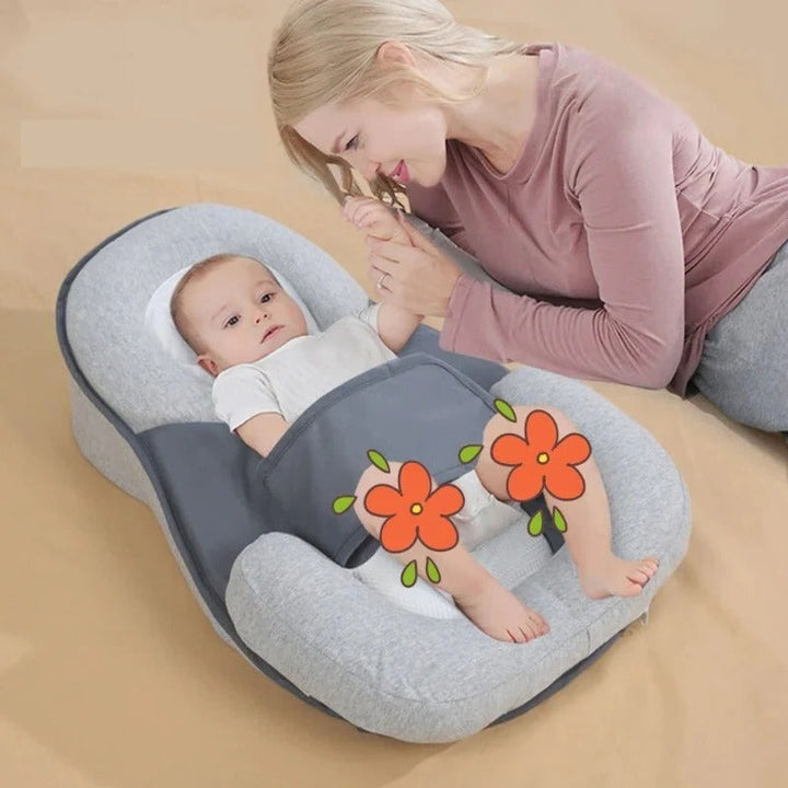 Baby anti-spit-up inclined sleep support pillow for reflux relief & comfortable newborn sleep.
