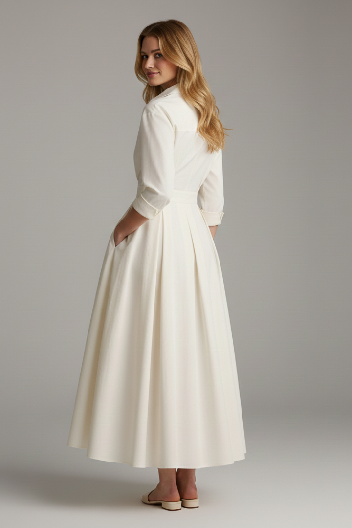 Women's long sleeve midi dress with elegant button-front, defined waist, and flared hem in a classic style.