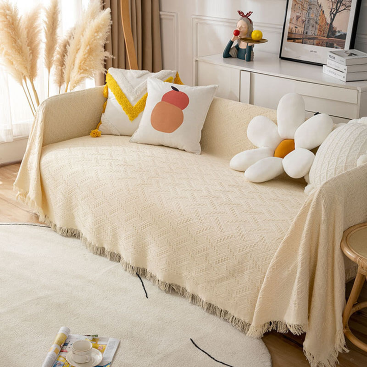 Beige stretchable pet-friendly sofa cover slipcover, soft & machine washable for living room furniture protection.