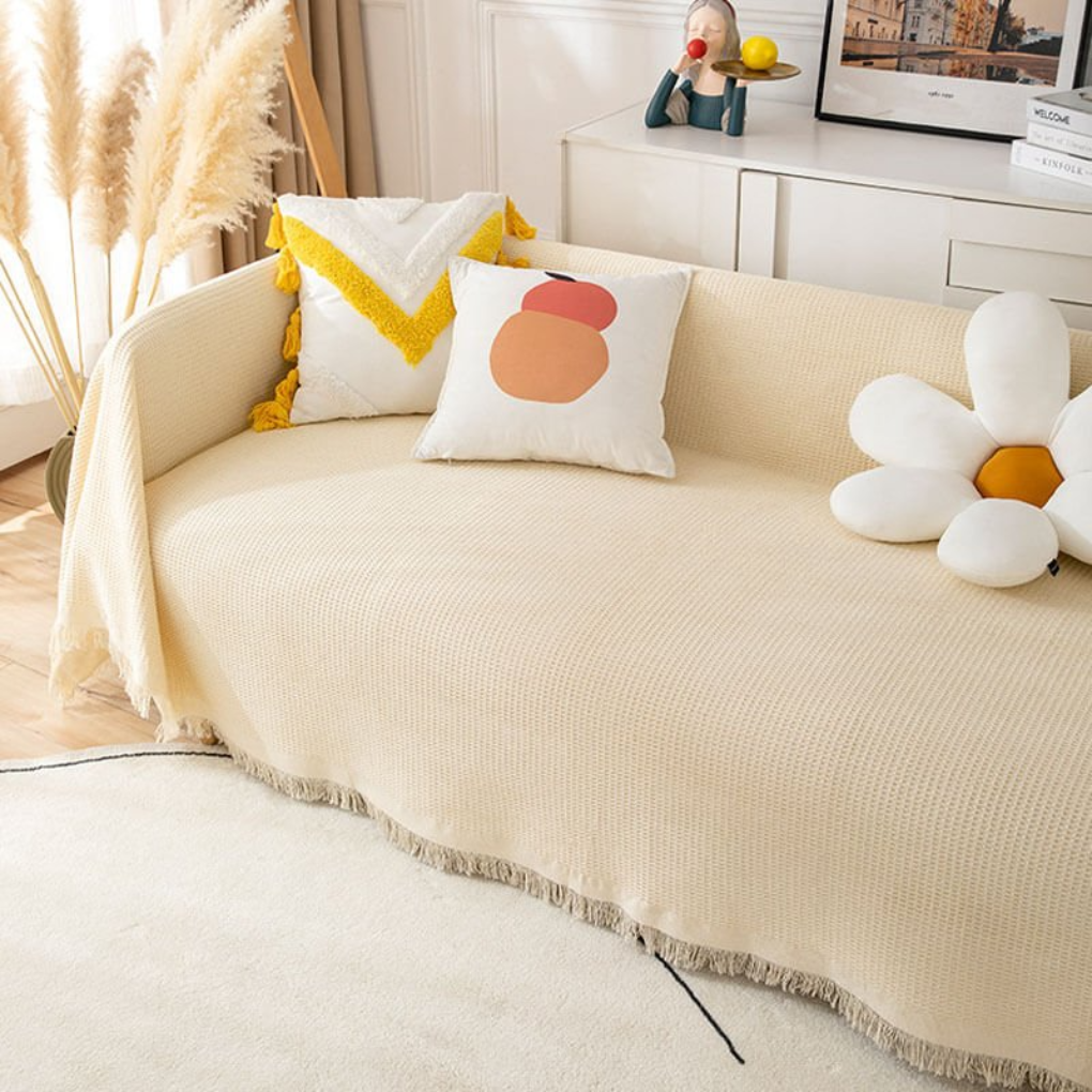 Soft beige stretch sofa slipcover, pet-friendly furniture protector for living room decor & easy cleaning.