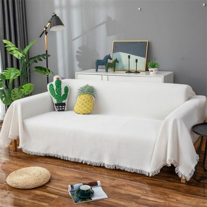 Pet-friendly soft white sofa slipcover, a stretchable furniture protector for stylish living room home decor.