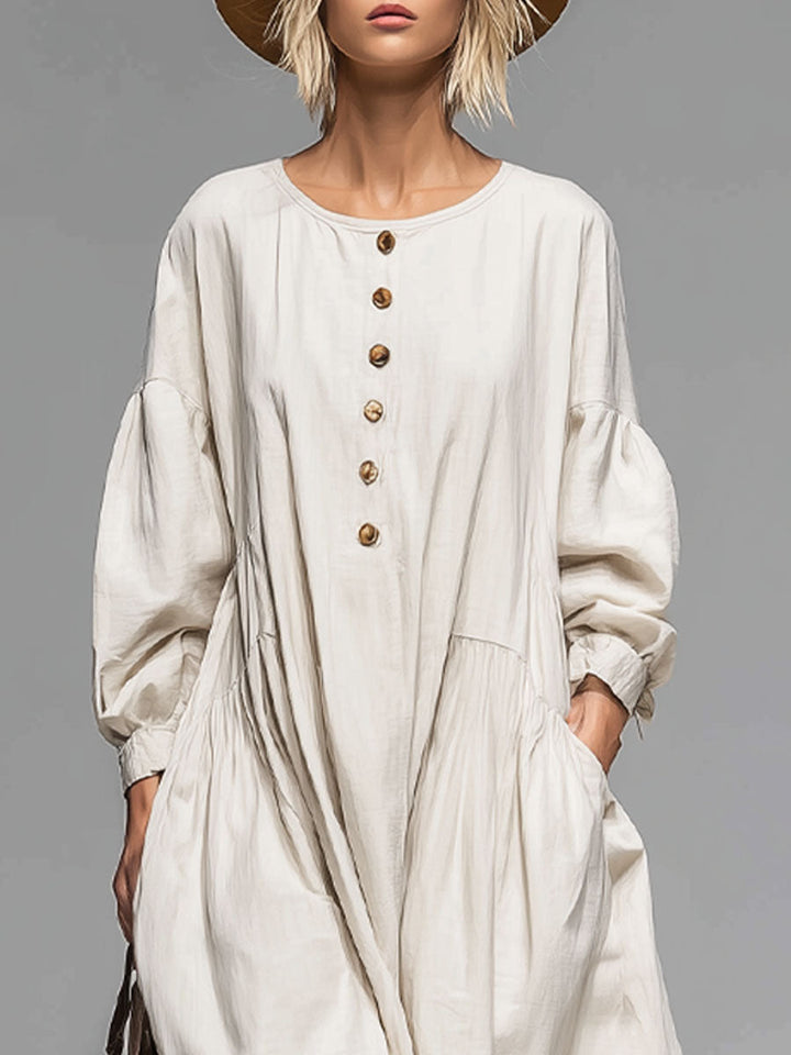 Comfortable loose-fit long sleeve midi dress for women, button-front with pockets. Versatile for spring/fall.