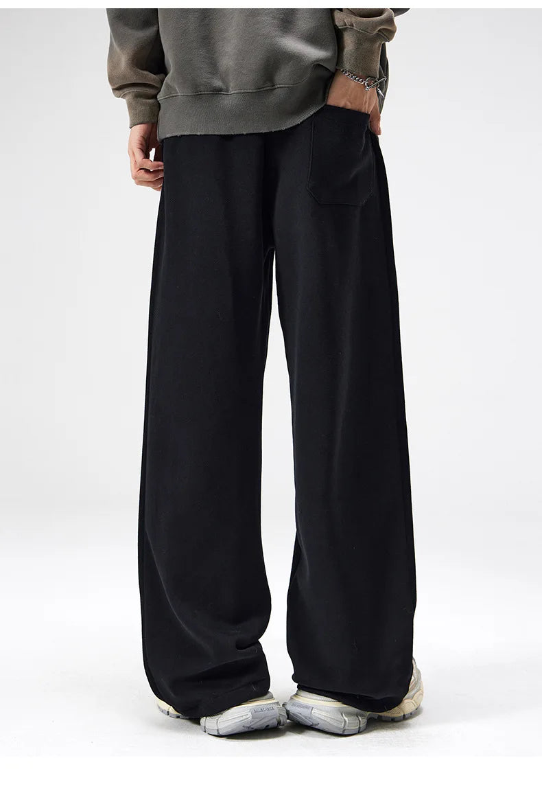 Black men's wide leg drawstring casual pants for relaxed comfort and everyday wear.