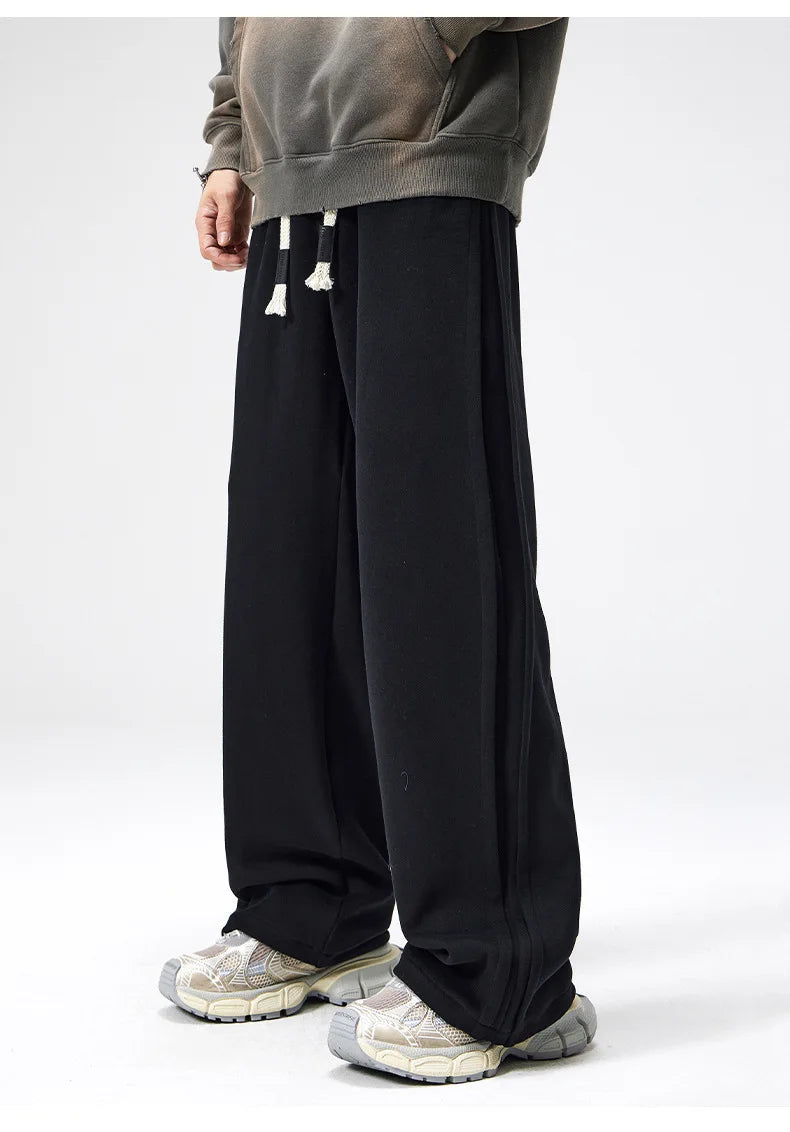 Apricot men's wide leg drawstring loungewear pants. Comfortable & relaxed fit for athleisure style.