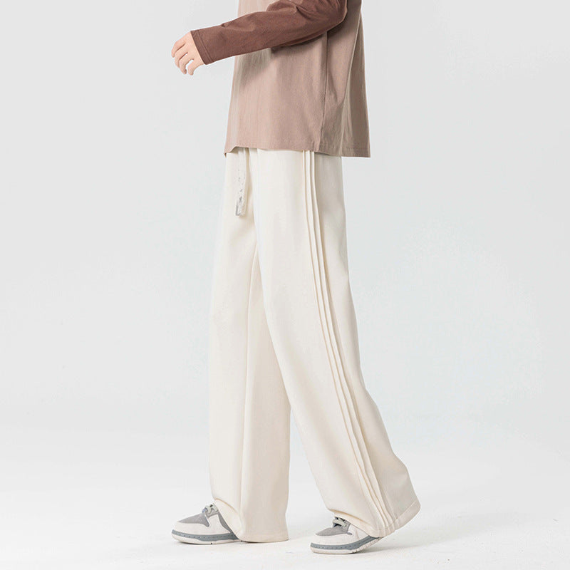 Dark gray men's wide leg chino trousers with drawstring. Versatile & comfortable for casual or everyday style.