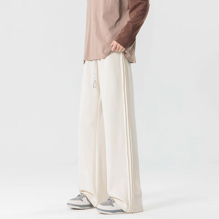 Black men's wide leg athleisure pants with drawstring. Relaxed fit for ultimate comfort & everyday style.