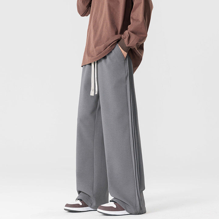 Comfortable men's wide leg drawstring pants. Relaxed fit chinos, perfect for casual and loungewear styles.