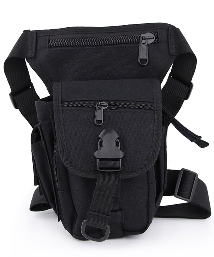 Black oxford cloth unisex adventure hip pack worn as a fanny pack, close-up, showing main compartment and front pocket.