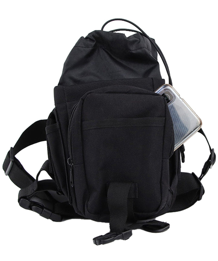 Versatile black oxford cloth hip pack, styled as a waist bag on an adventurer, highlighting durability and hands-free use.
