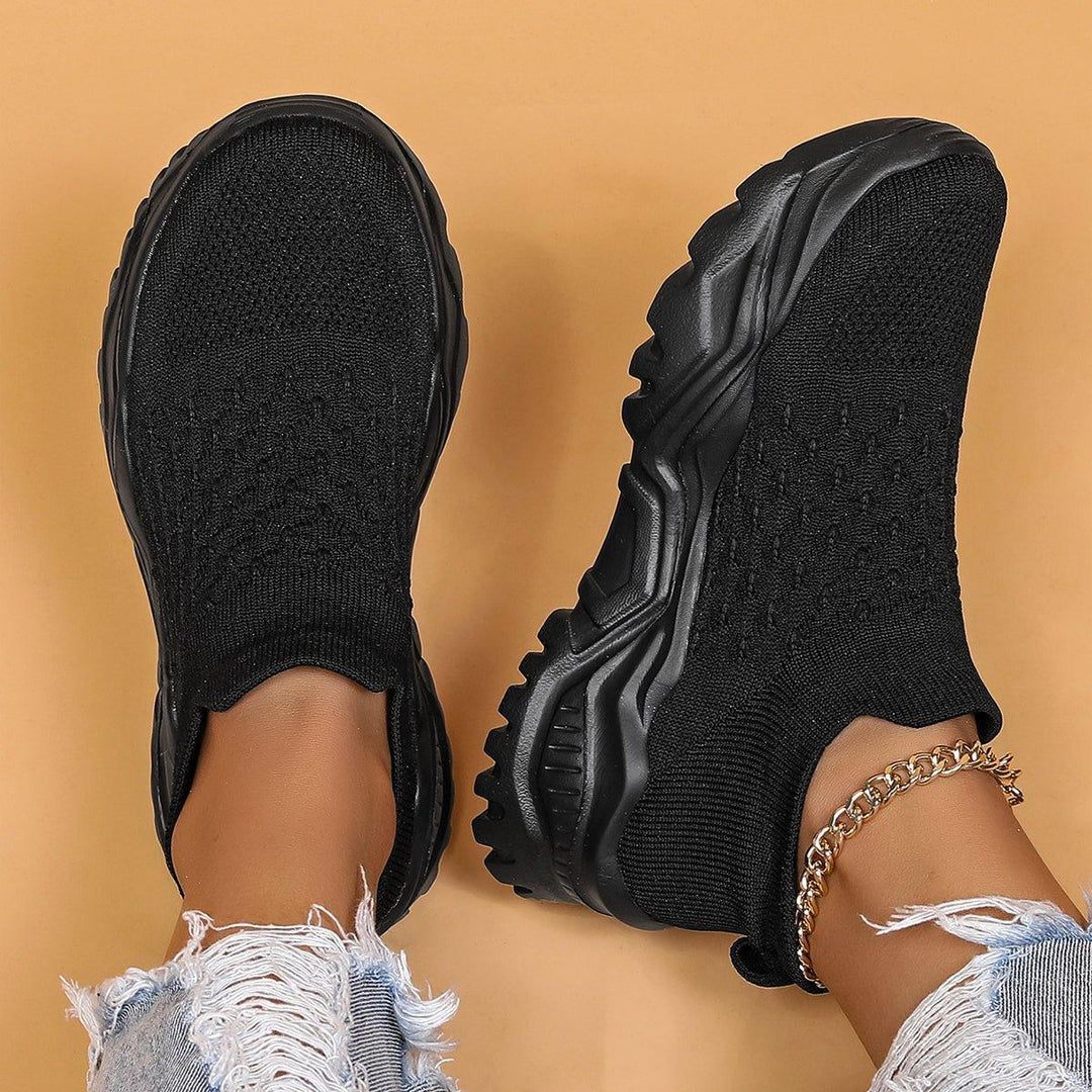 Unisex black slip-on shoes, a blend of orthopedic support and cloud-like comfort.