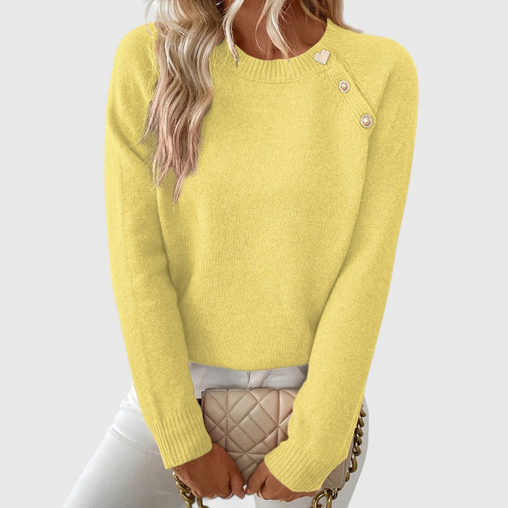 Orange women's crew neck pullover, a stylish long sleeve sweater with elegant pearl buttons.
