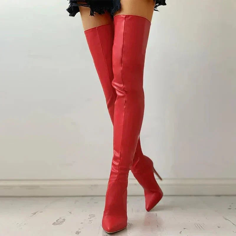 Fashionable women's tall over-the-knee boots. Sleek design, pointed toe, and elegant stiletto heel for parties.