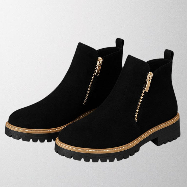 Classic black round toe side zip shoes for women, comfortable and versatile for everyday wear.