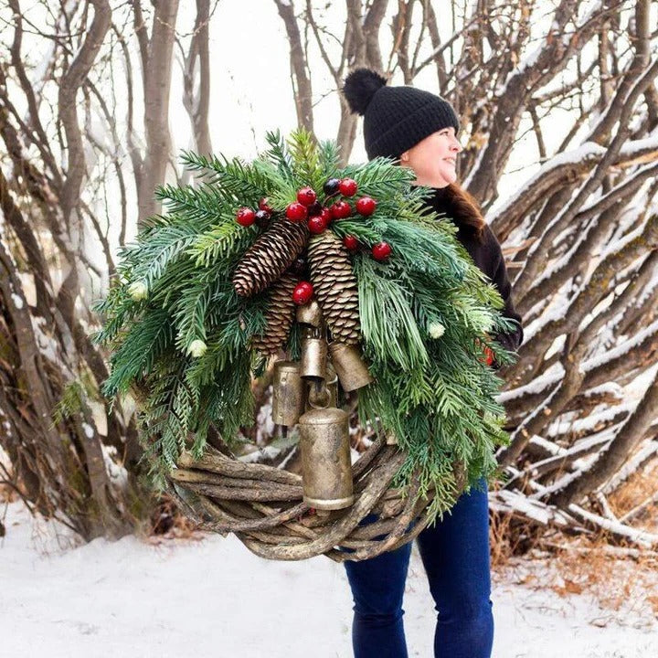 Bohemian Christmas wreath with floral accents. Handcrafted holiday front door decor featuring berries & pinecones.