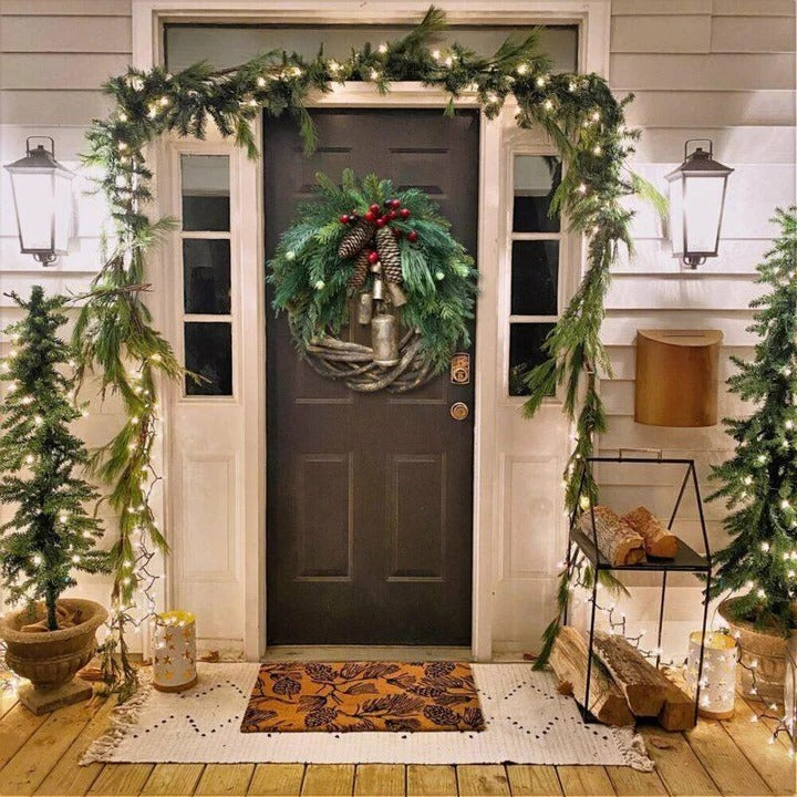 Festive winter wreath, bohemian style, with delicate floral accents. Perfect for indoor or outdoor holiday decoration.