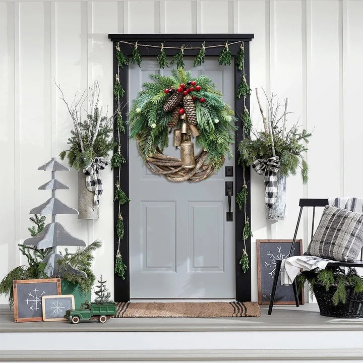 Handcrafted bohemian Christmas wreath. Detailed with pinecones, berries, and floral accents for festive home decor.