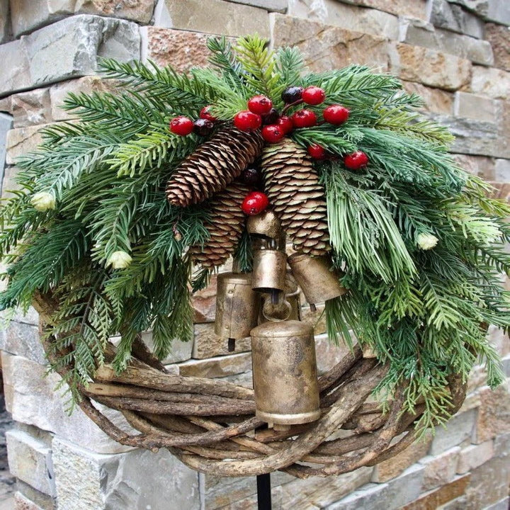 Unique bohemian Christmas front door wreath. Seasonal holiday decoration with beautiful floral and berry accents.