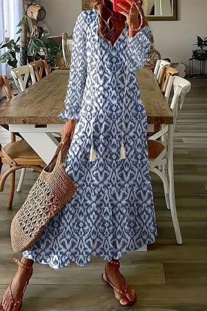Full shot of a women's long floral print maxi dress, ideal for spring fashion, beach vacations, and a relaxed boho style.