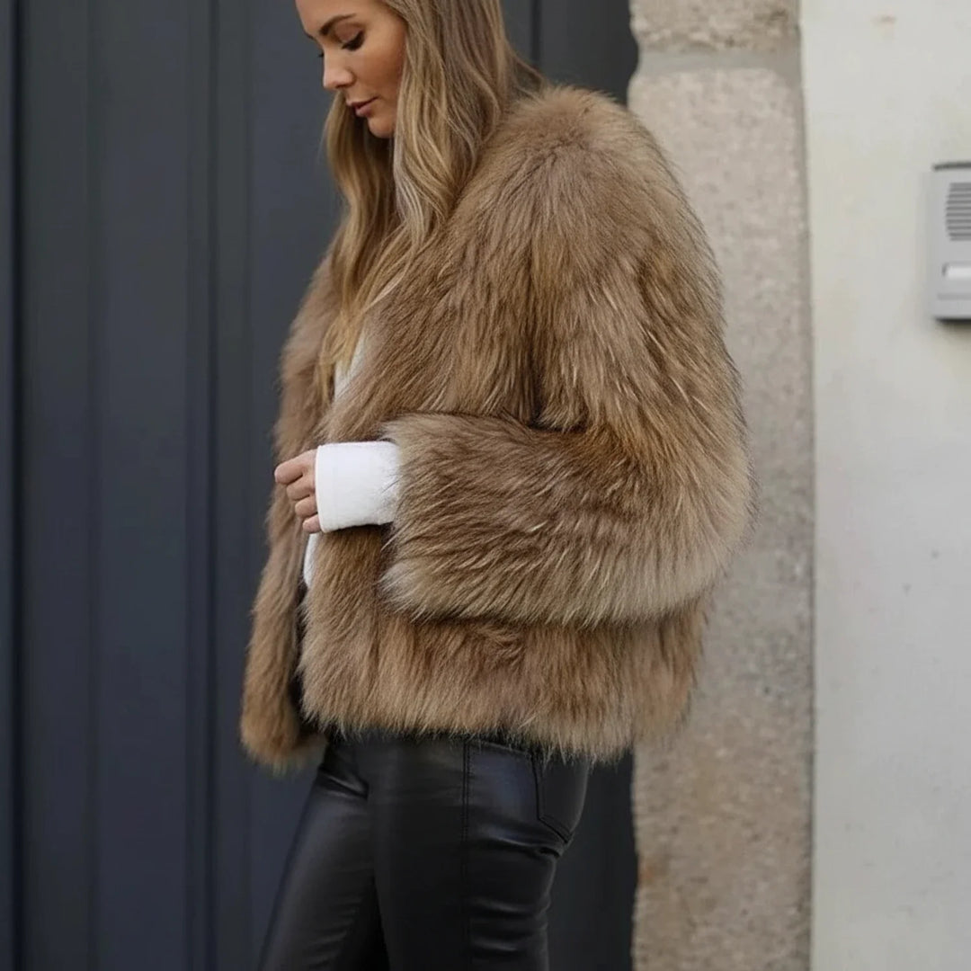 Brown women's chic cropped jacket. Stylish and cozy outerwear, perfect for a casual or evening fashion statement.