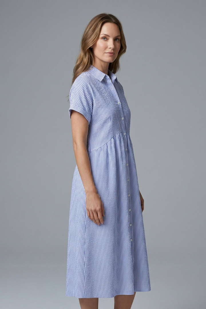 Flattering plus size midi dress with chic button-front & collar. A versatile elegant dress for women.
