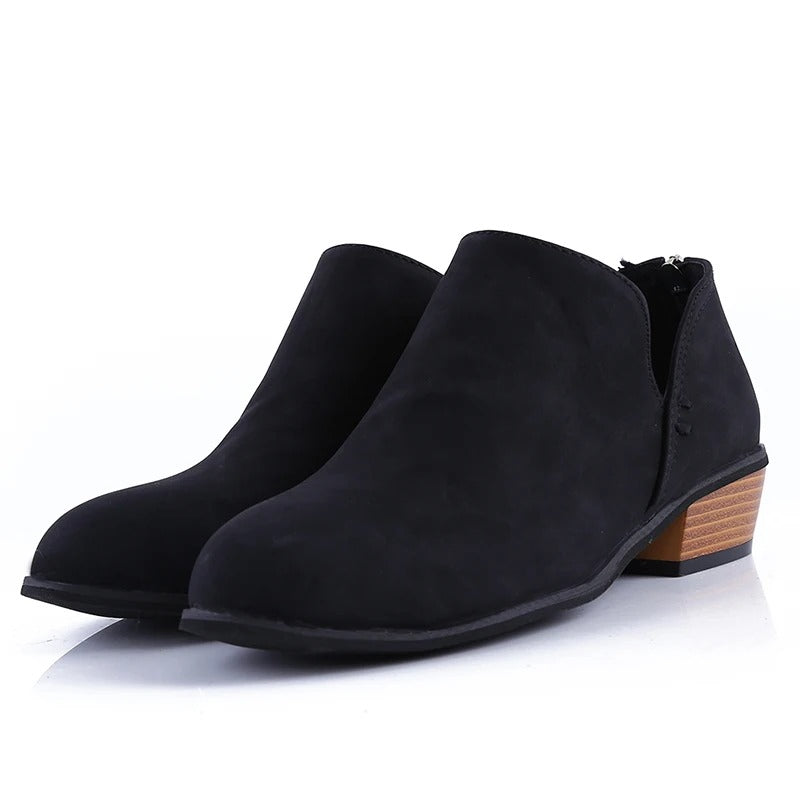 Stylish women's ankle boots with a low block heel, trendy back zip, and comfortable rounded toe for any outfit.