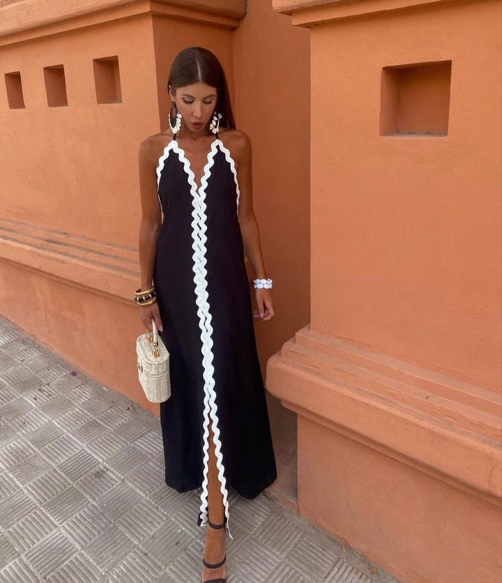 Chic women's black and white contrast trim maxi wedding guest dress, elegant V-neck sleeveless formal wear.