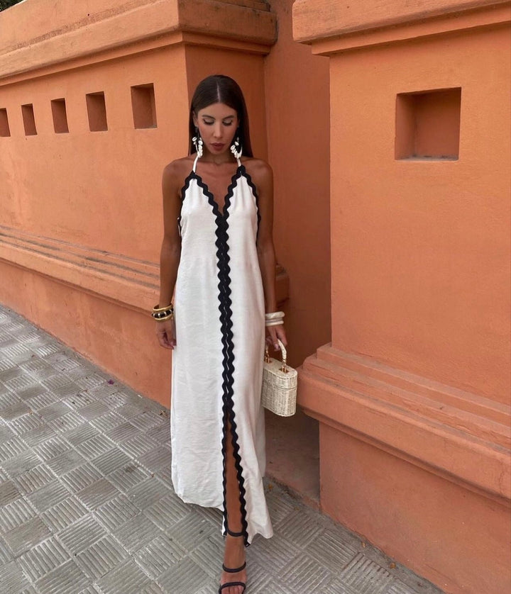 Elegant women's maxi wedding guest dress with contrast trim, V-neck, sleeveless. Perfect for summer resort wear.