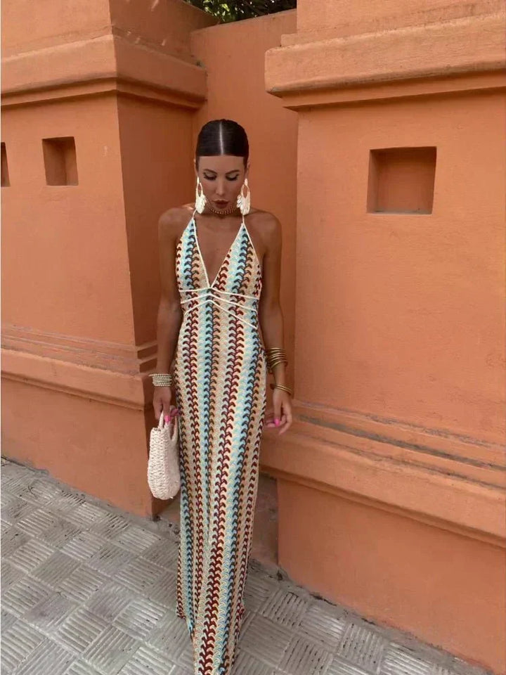 Chic women's boho printed maxi wedding guest dress, V-neck halter, open back, multicolor summer style.