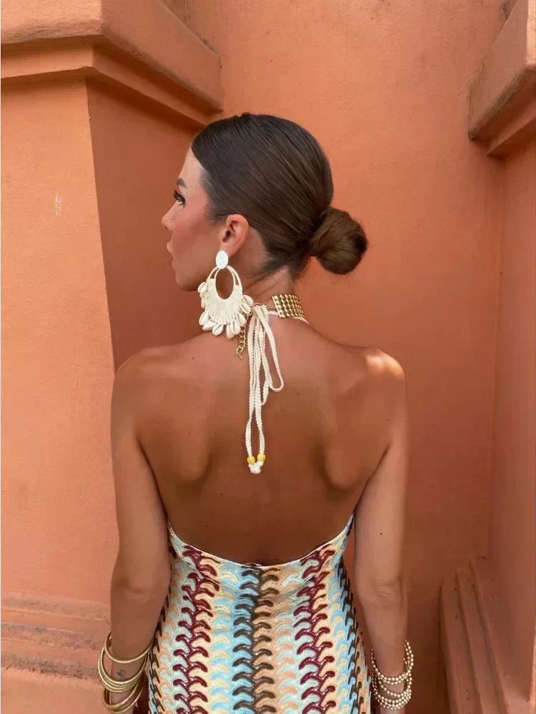 Women's elegant boho printed maxi dress, V-neck, open back. Ideal for wedding guests & summer events.