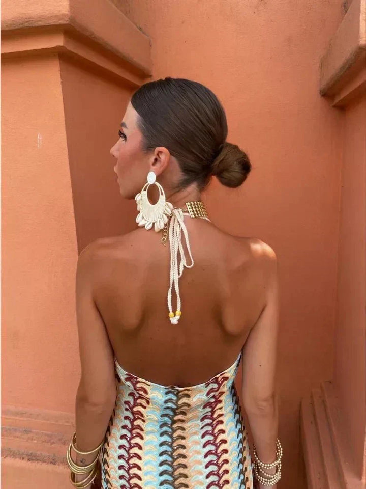 Women's elegant boho printed maxi dress, V-neck, open back. Ideal for wedding guests & summer events.