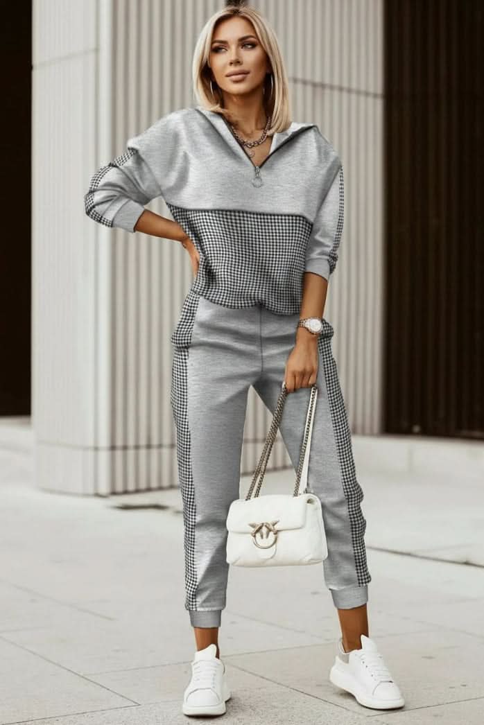 Woman wearing a chic two-piece casual tracksuit set, ideal for effortless everyday fashion & comfortable lounging.