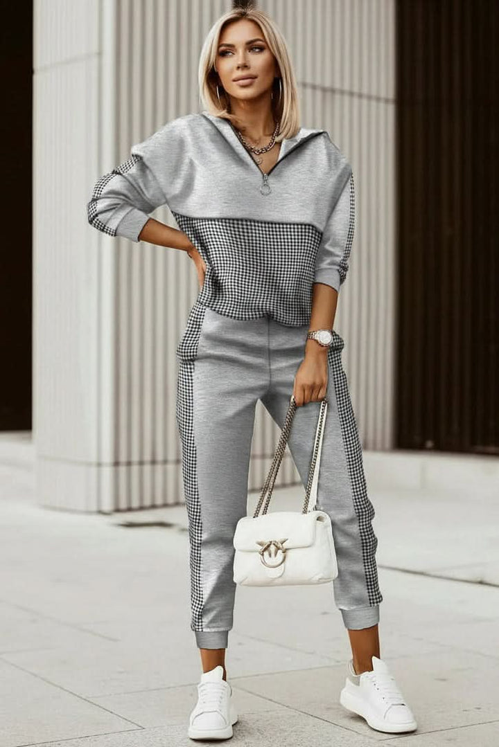 Neatly folded women's casual tracksuit set, showcasing soft fabric for comfortable lounge & athleisure wear.