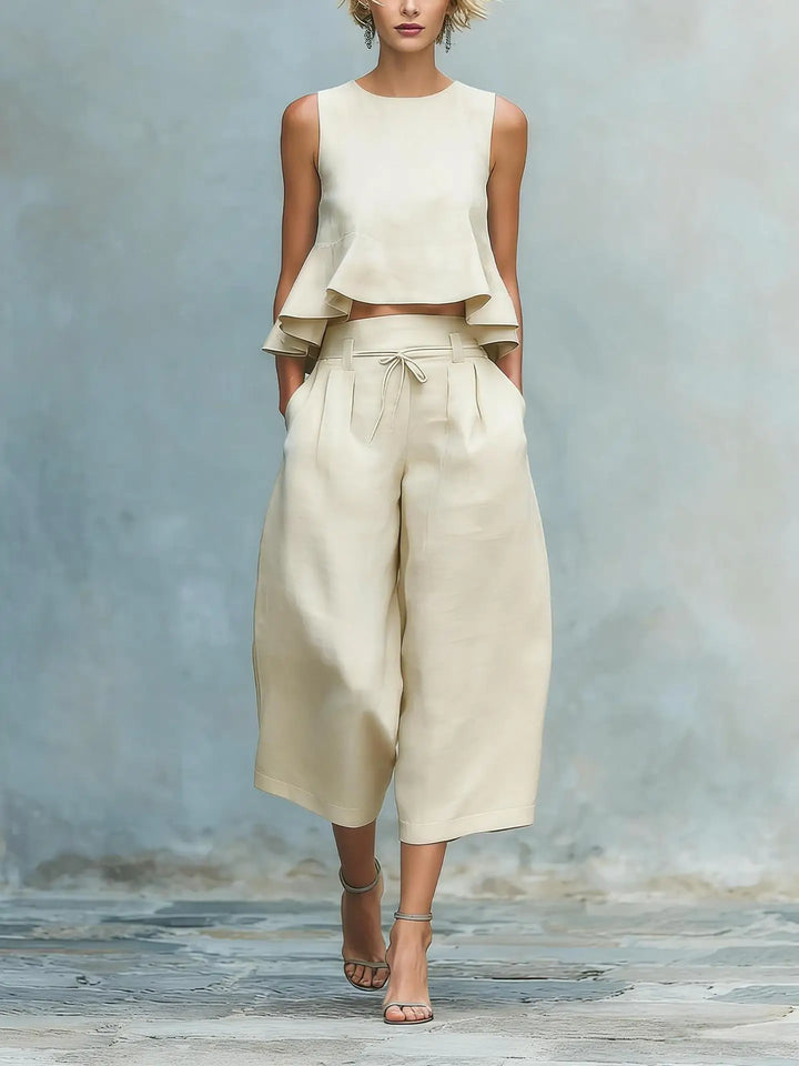 Fashionable women's matching crop top & wide leg pant outfit. Effortless two-piece set for summer style.