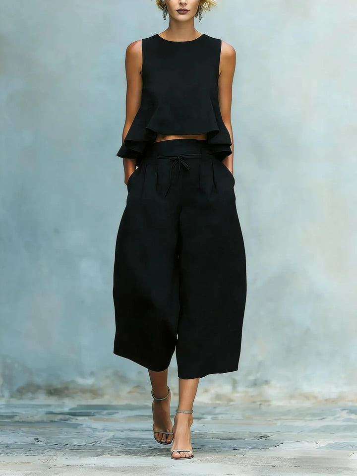 Women's sleeveless crop top & wide leg pant suit. A relaxed fit two-piece set for spring/summer fashion.