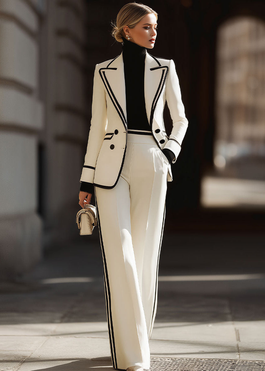 Chic women's double-breasted suit set with contrast trim. Perfect professional attire for office or formal wear.