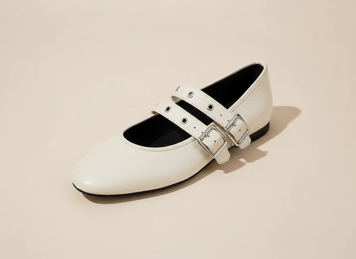 Elegant women's double strap buckle flats. Comfortable, chic footwear ideal for everyday style, office or casual outings.