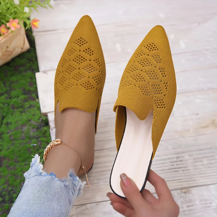 Stylish women's slip-on flat mules, ideal for effortless casual summer fashion. Comfortable everyday sandals.