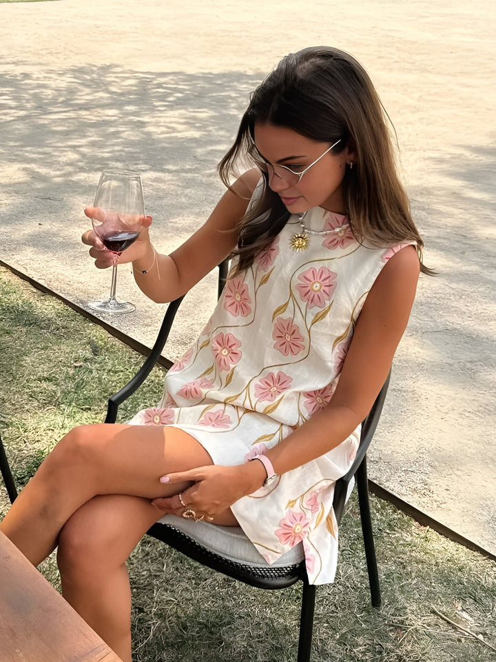 Chic women's floral A-line mini dress with mock neck. Perfect sleeveless summer or spring party dress for elegant style.