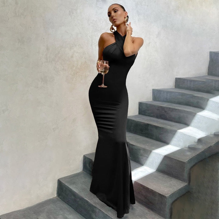 Chic women's halter mermaid maxi dress for wedding guests. Elegant bodycon formal wear, perfect for evening events.