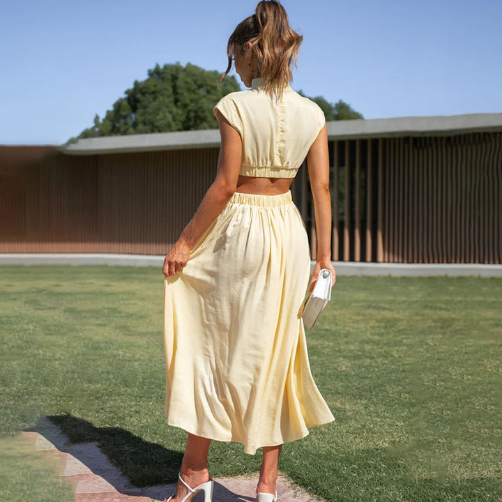 Sophisticated women's high-neck cutout midi dress, perfect as a wedding guest or formal event attire.