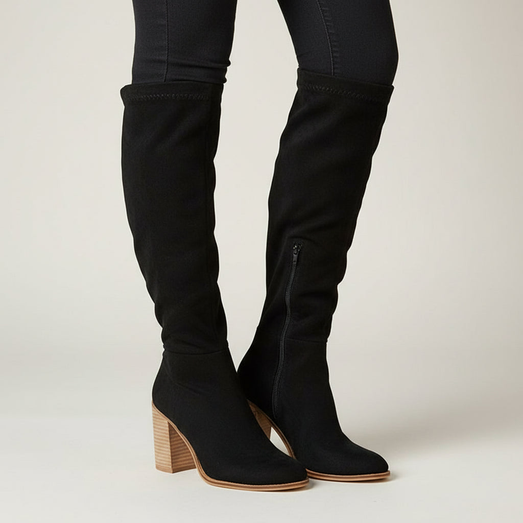 Elegant women's knee-high block heel boots with arch support. Pointed toe for comfortable, stylish winter fashion.