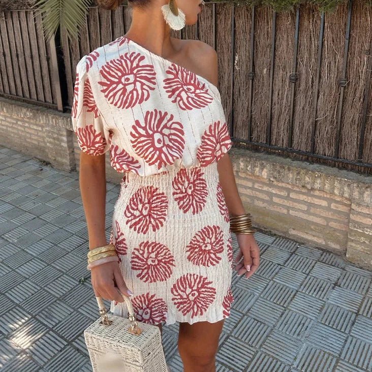 Chic women's one-shoulder mini dress with vibrant print, perfect for a wedding guest, summer party, or special occasion.