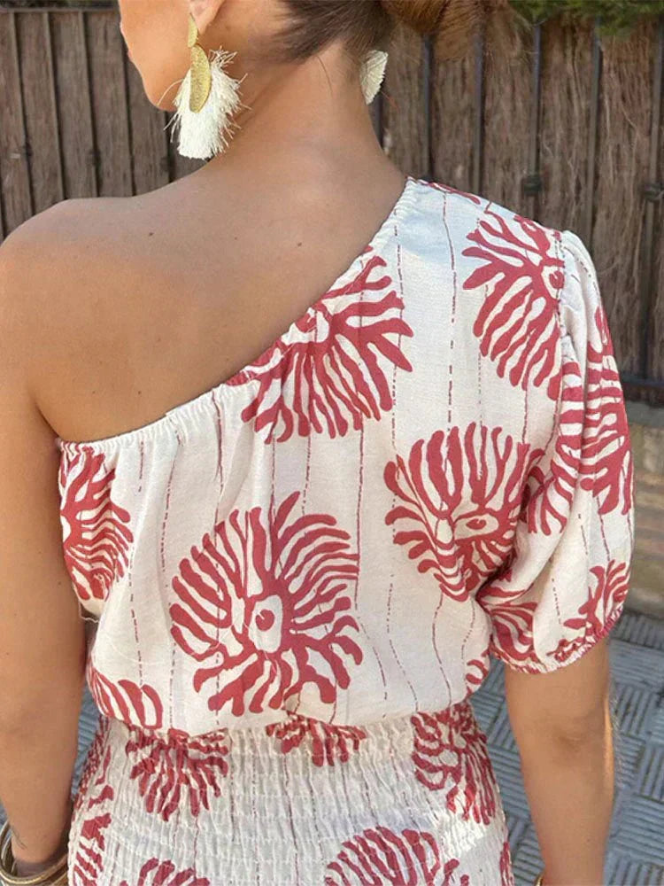 Stylish women's printed mini dress with a one-shoulder design. A chic choice for wedding guests, parties, or vacation.