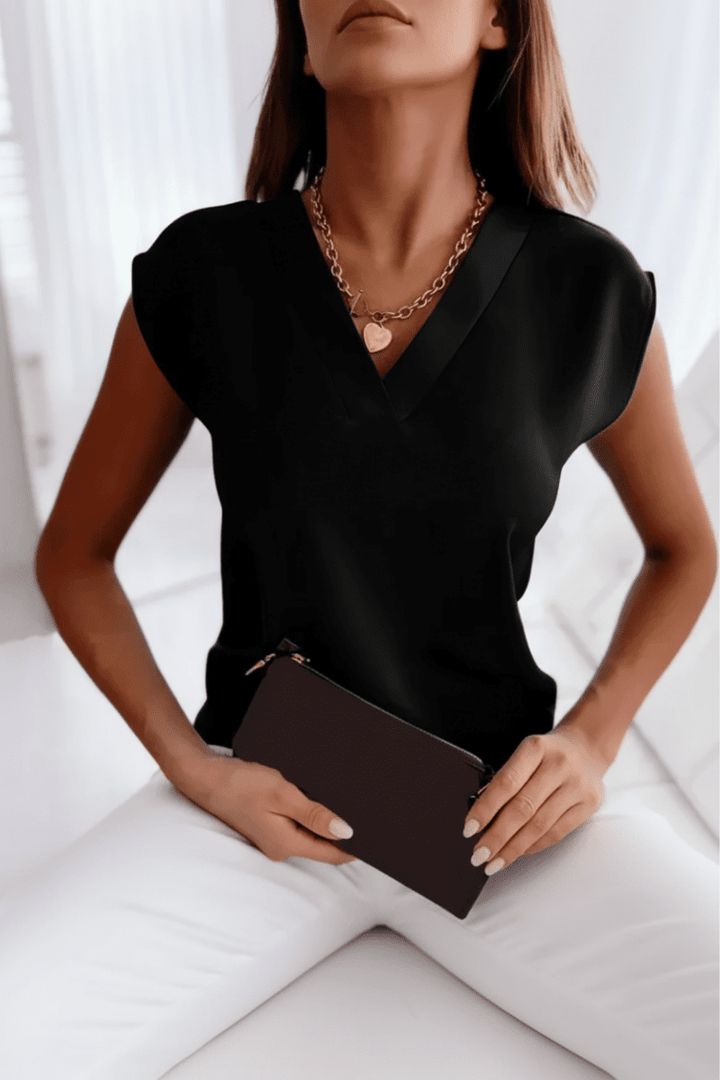 Modern women's going out top, open back for a chic look. Perfect evening wear with a flattering fit for summer.
