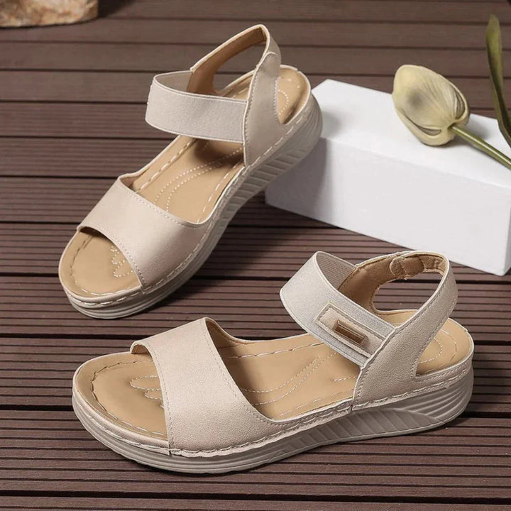 Women's comfortable open-toe sandals, versatile casual footwear for daily wear and warm weather comfort.