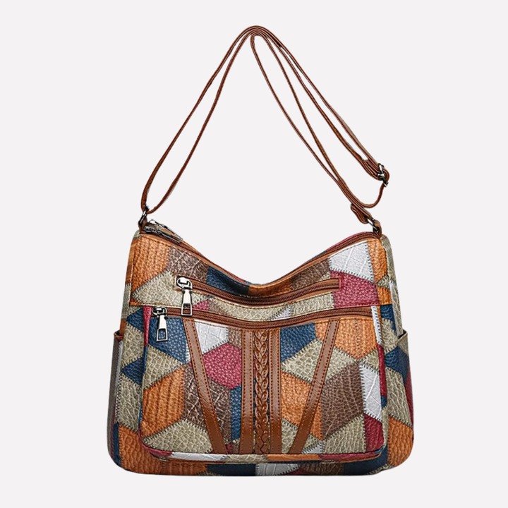 Chic women's patchwork shoulder bag with braided strap detail. Versatile fashion accessory for everyday use.