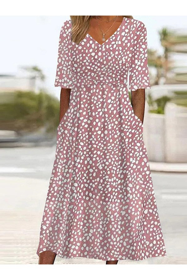 Chic women's pink polka-dot V-neck A-line summer dress with pockets. Comfortable, knee-length, casual style.