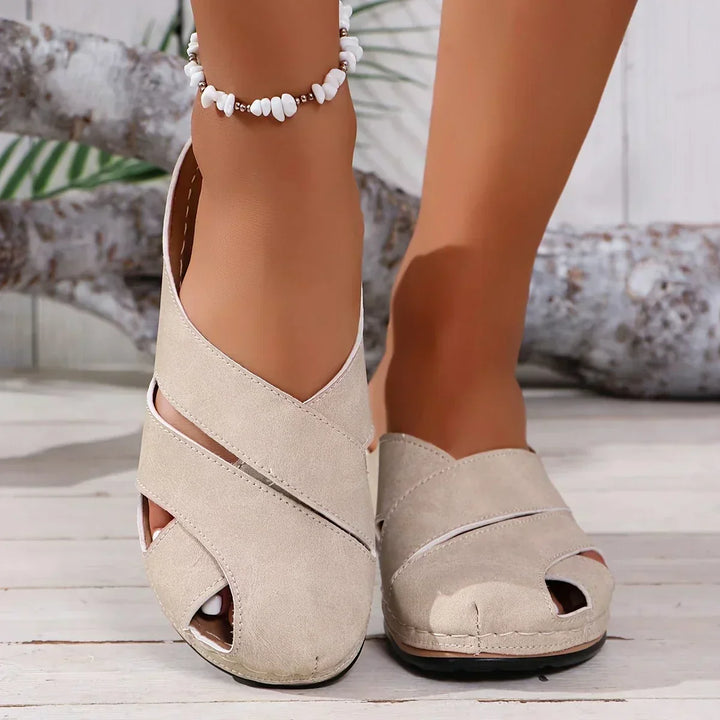 Elegant women's wedge sandals with a sturdy platform, enhancing height while providing stable and fashionable support.