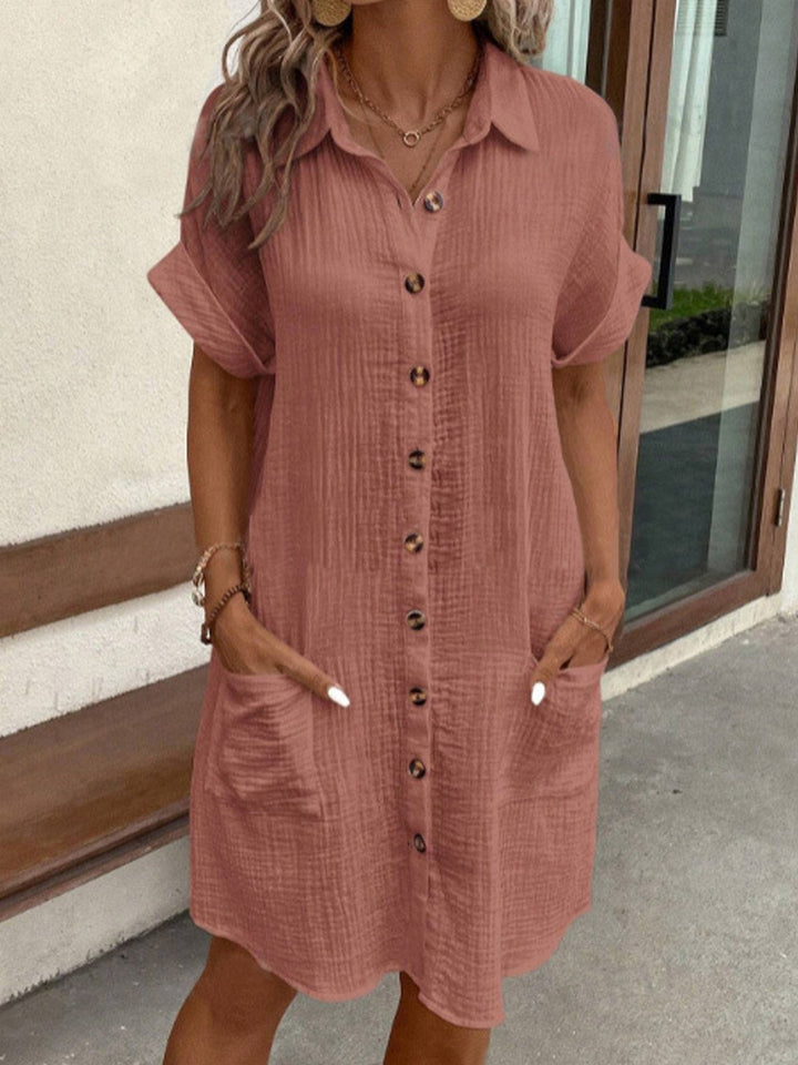 Comfortable women's polo dress with practical pockets, short sleeves, and button-front. Great for daily casual wear.
